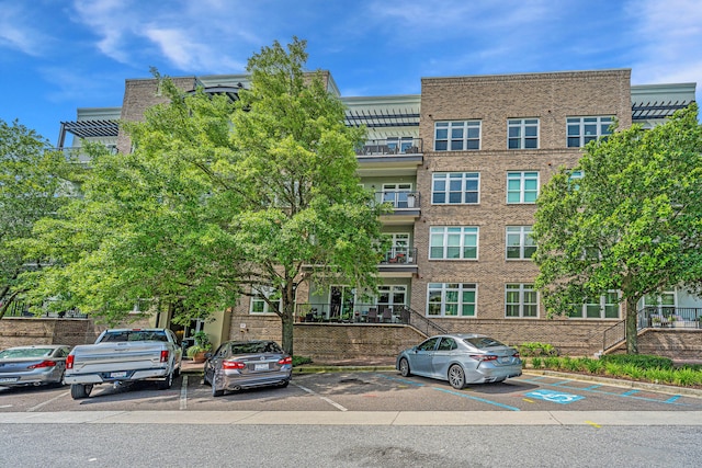 145 Pier View St Unit 214, Daniel Island, SC 29492 - view of building exterior with uncovered parking