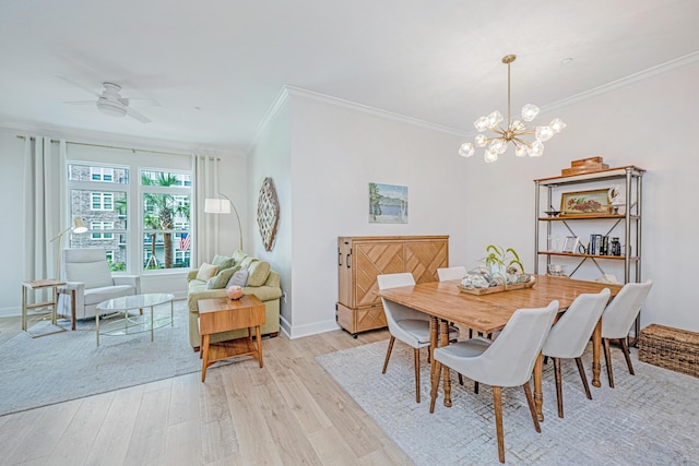 145 Pier View St Unit 214, Daniel Island, SC 29492 - dining space with ornamental molding, light wood finished floors, a chandelier, a ceiling fan, and baseboards