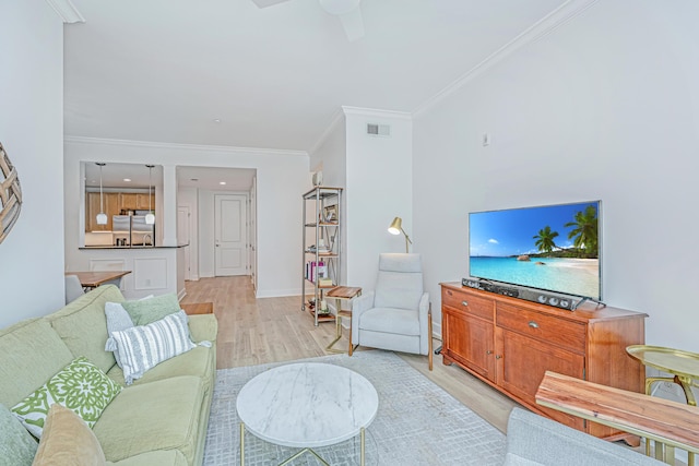 145 Pier View St Unit 214, Daniel Island, SC 29492 - living area with light wood finished floors, crown molding, a ceiling fan, and baseboards