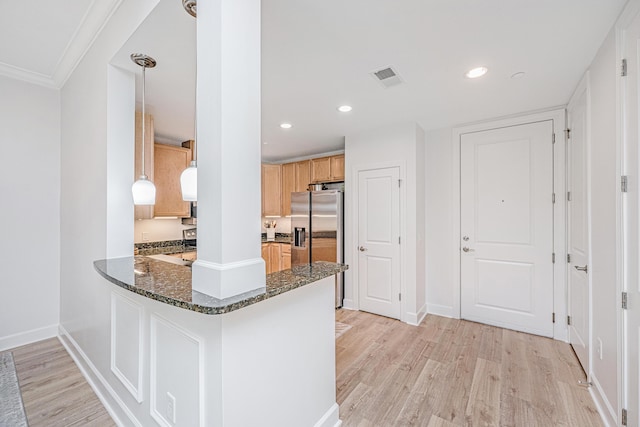 145 Pier View St Unit 214, Daniel Island, SC 29492 - kitchen with light wood-style flooring, stainless steel fridge with ice dispenser, dark stone countertops, a peninsula, and ornamental molding