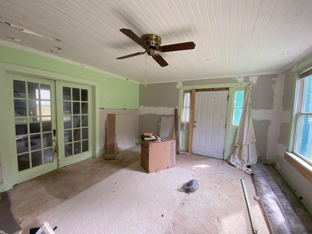 interior space featuring a wealth of natural light, ornamental molding, french doors, and ceiling fan