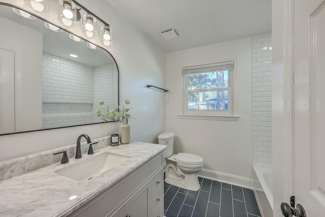 full bathroom with vanity, tiled shower / bath combo, and toilet