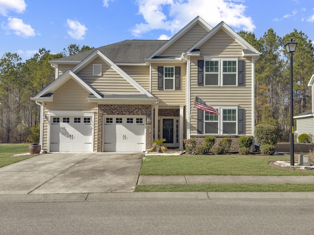 view of front of property featuring a garage and a front lawn