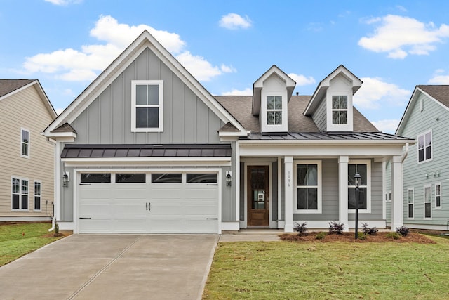 772 Opal Wing St, Moncks Corner, SC 29461 - view of front of house featuring board and batten siding, driveway, a standing seam roof, a front lawn, and a porch