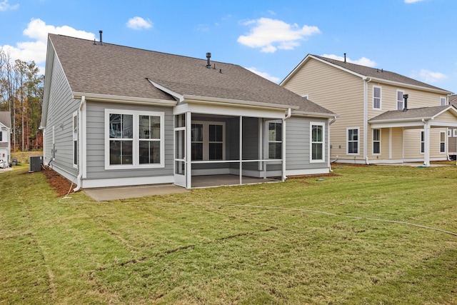 772 Opal Wing St, Moncks Corner, SC 29461 - back of property featuring a sunroom, a lawn, roof with shingles, and central air condition unit