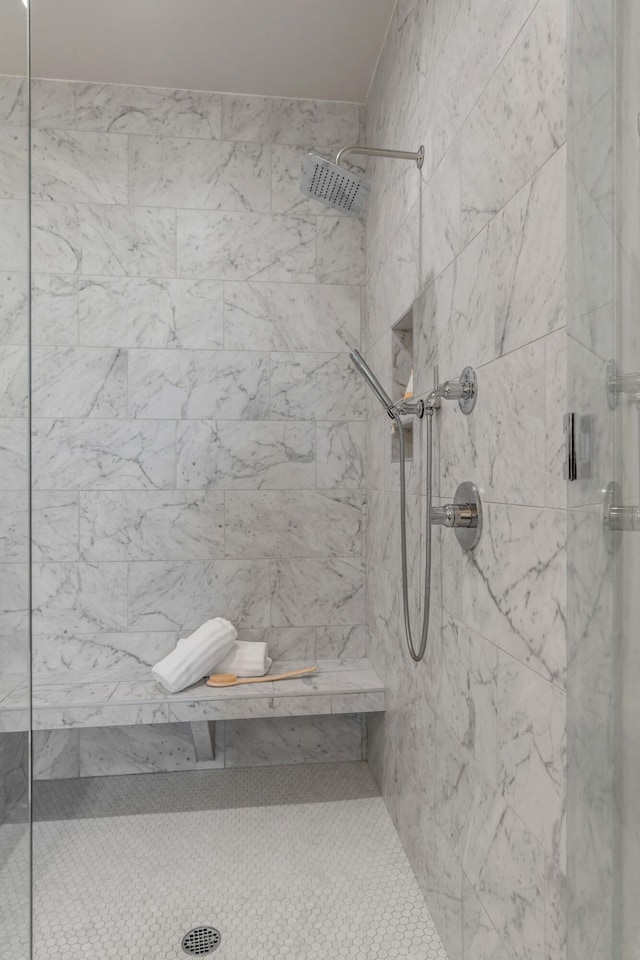 bathroom with tiled shower