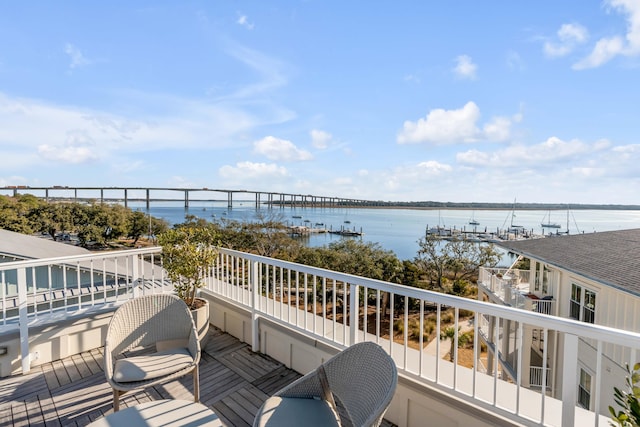 balcony featuring a water view