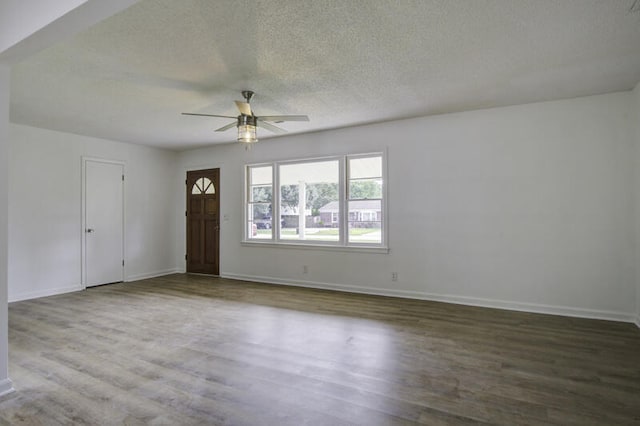 interior space with ceiling fan, a textured ceiling, and hardwood / wood-style floors