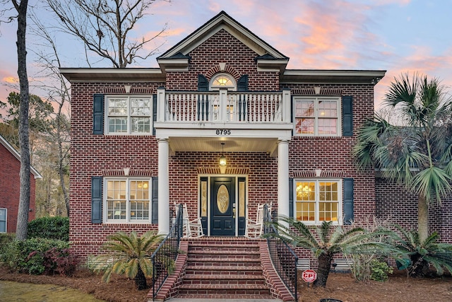 view of front of house with a balcony