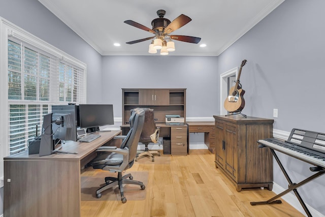 office space featuring crown molding, ceiling fan, and light wood-type flooring