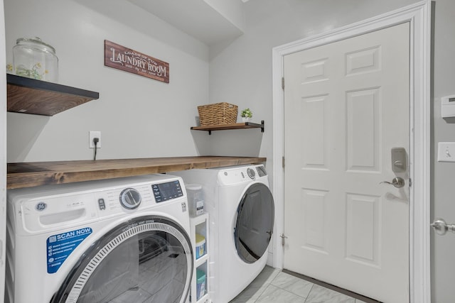 washroom with independent washer and dryer