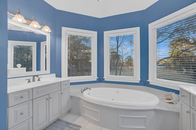 bathroom featuring vanity and a bath