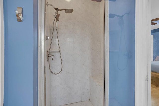 bathroom with tiled shower