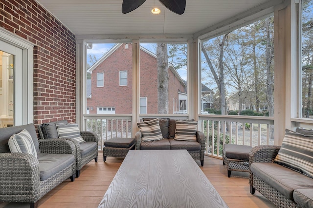 sunroom / solarium with ceiling fan