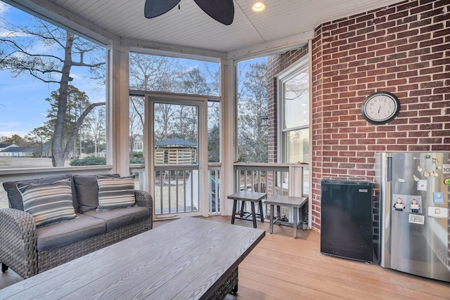 sunroom / solarium with ceiling fan