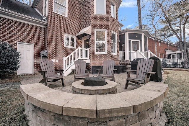 view of patio / terrace with an outdoor fire pit