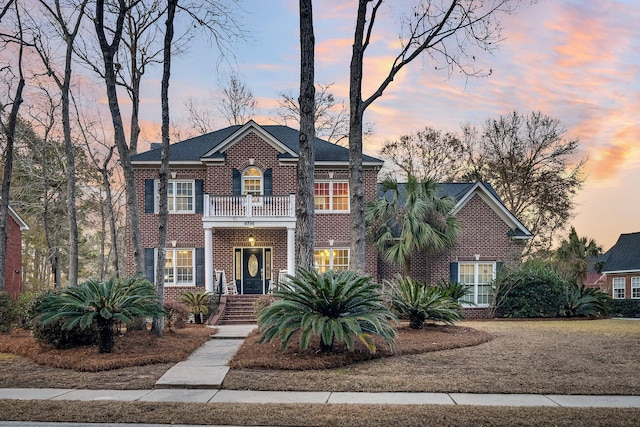 colonial-style house with a balcony