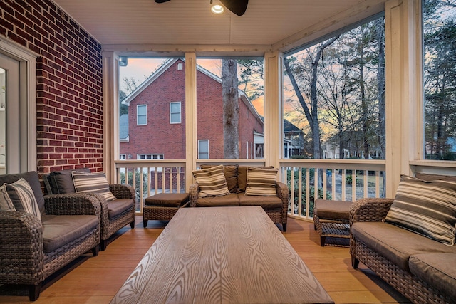 sunroom with plenty of natural light and ceiling fan