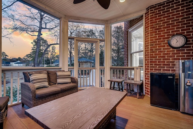 sunroom / solarium with ceiling fan