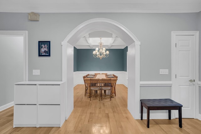 dining area with a notable chandelier and light hardwood / wood-style flooring