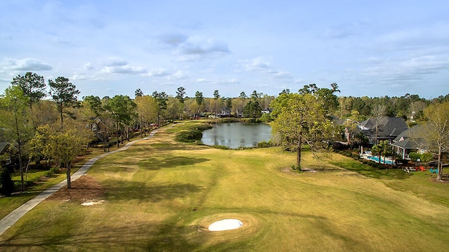 exterior space featuring a water view and a lawn