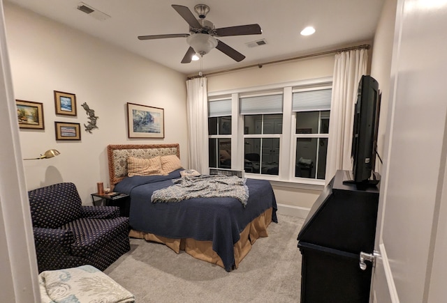 bedroom with light colored carpet, visible vents, ceiling fan, and recessed lighting