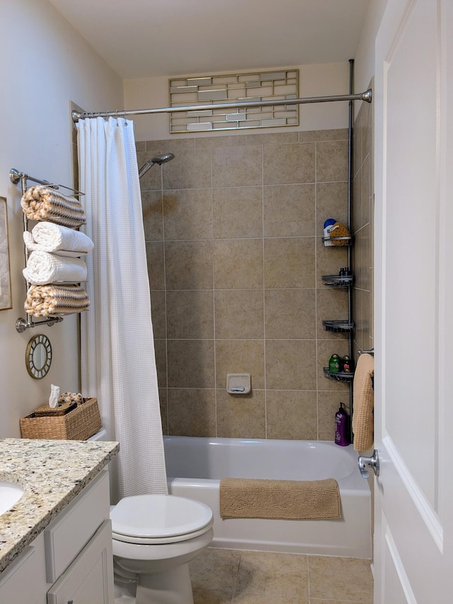 bathroom featuring shower / bath combination with curtain, tile patterned flooring, vanity, and toilet