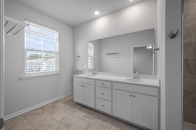 bathroom with tile patterned floors and vanity