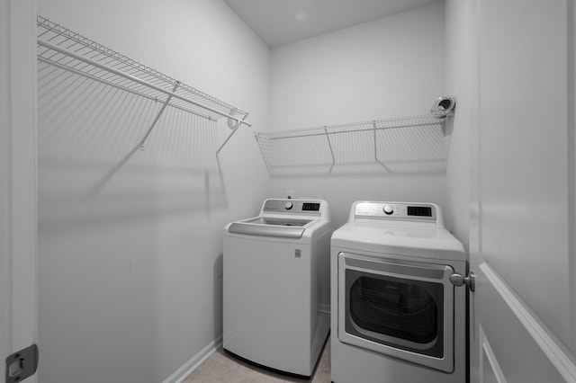 washroom with washer and clothes dryer