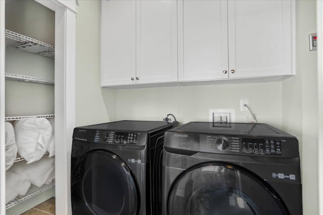 laundry area with cabinet space and washer and clothes dryer