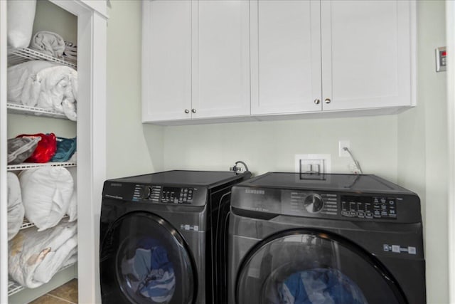 laundry area featuring cabinet space and washing machine and dryer