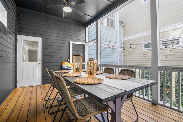 sunroom / solarium featuring ceiling fan