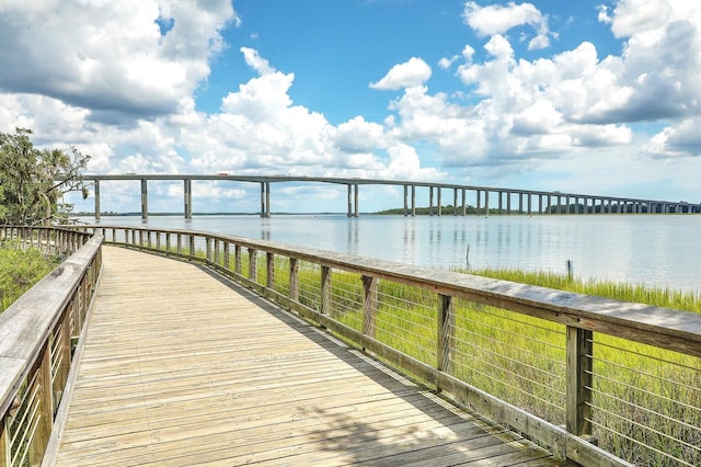 dock area with a pier and a water view