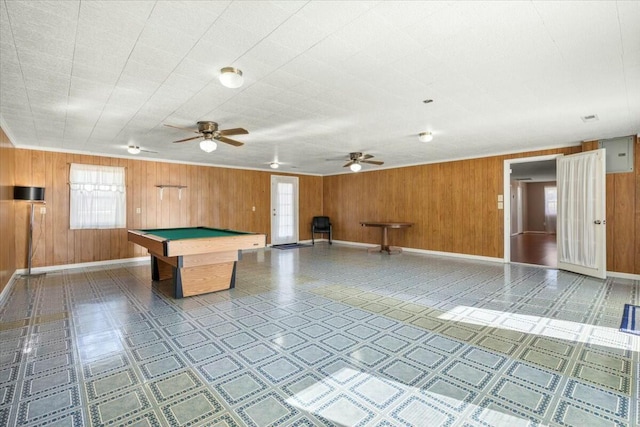 playroom with wooden walls and billiards