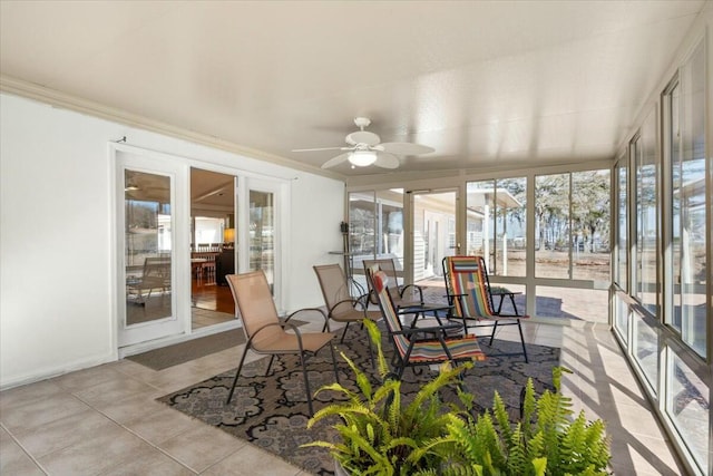 sunroom featuring ceiling fan and a healthy amount of sunlight