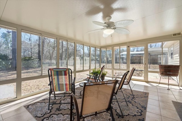 sunroom / solarium with ceiling fan