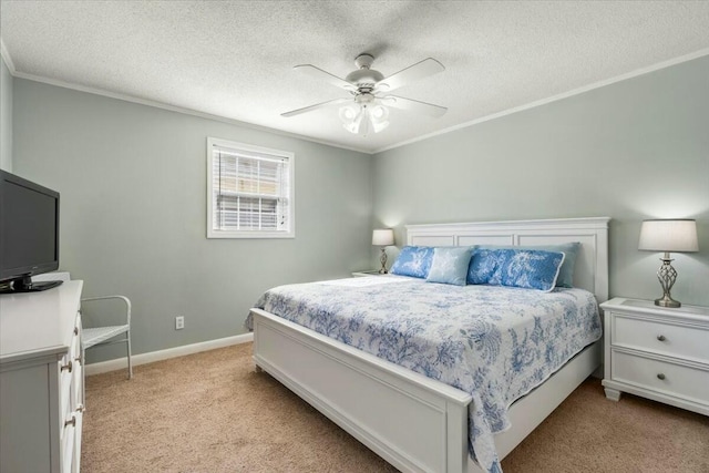 carpeted bedroom featuring crown molding, ceiling fan, and a textured ceiling