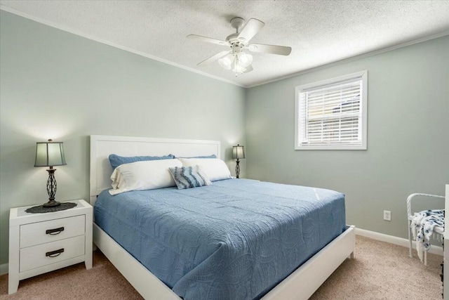 bedroom with crown molding, light colored carpet, and a textured ceiling