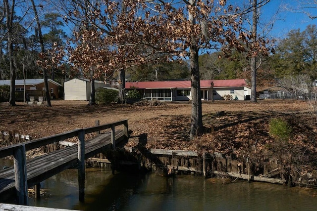 dock area featuring a water view