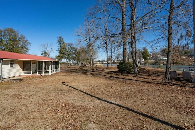 view of yard featuring a sunroom