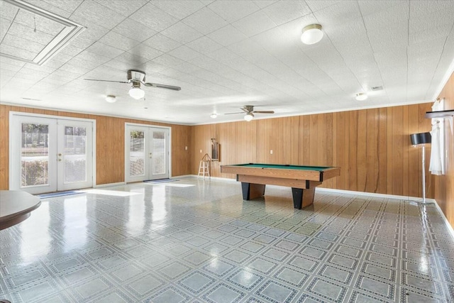 recreation room featuring pool table, wooden walls, and french doors