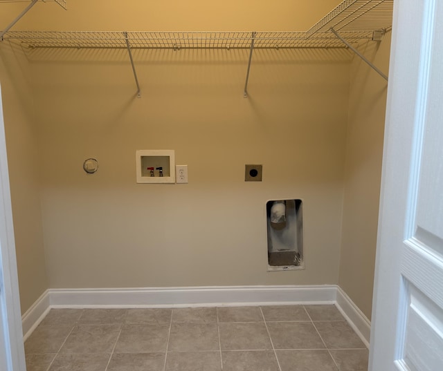 clothes washing area featuring electric dryer hookup, washer hookup, and tile patterned floors