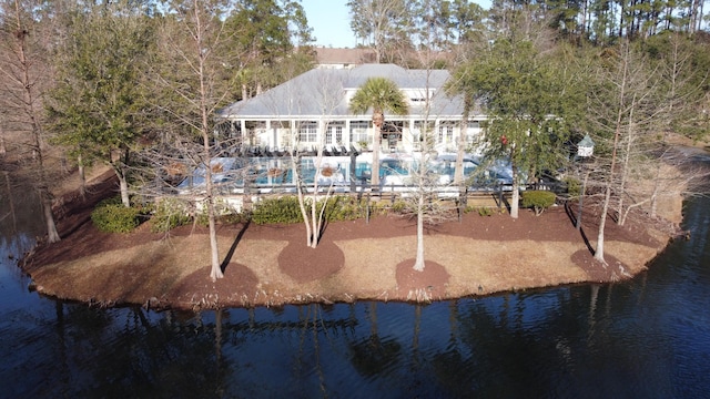 back of house featuring a water view