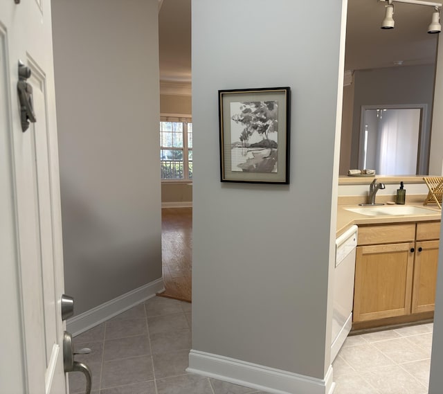 bathroom featuring tile patterned floors, rail lighting, and vanity