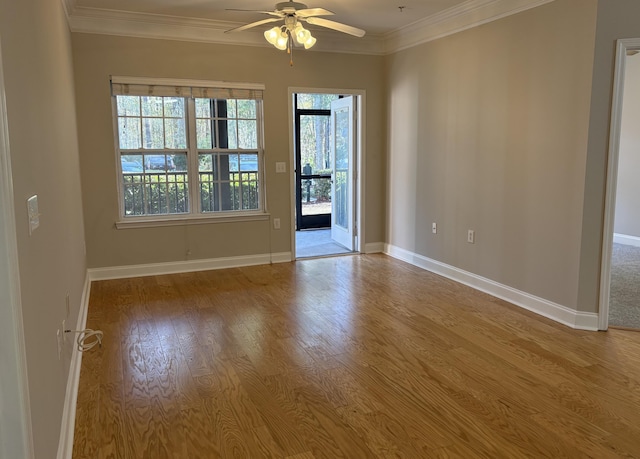 spare room with ceiling fan, ornamental molding, and light hardwood / wood-style floors