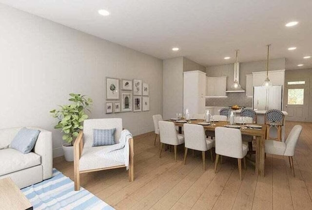 dining room with wood-type flooring