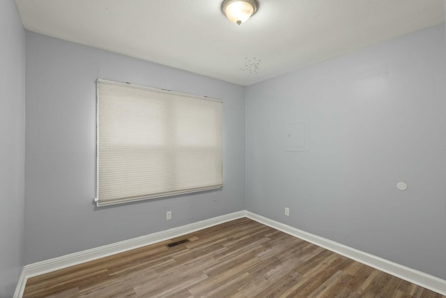 unfurnished room featuring hardwood / wood-style floors