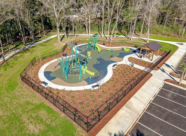 view of property's community featuring a yard and a playground