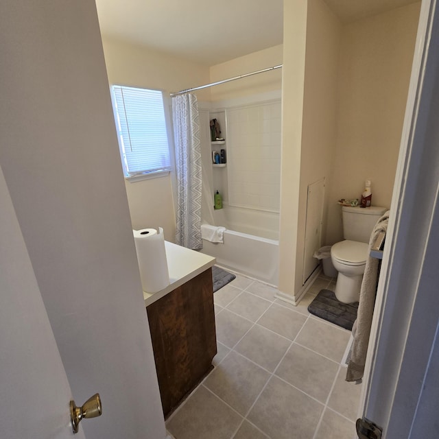 full bathroom with tile patterned floors, toilet, vanity, and shower / bath combo