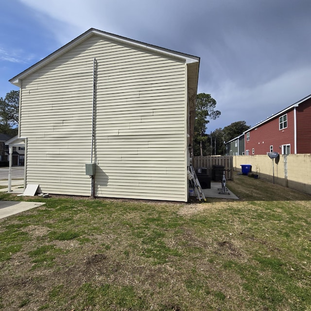 view of property exterior with a yard